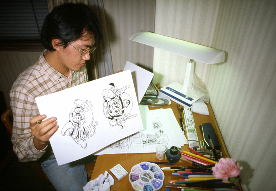 Manga artist Akira Toriyama sketches characters for his creation, Dr. Slump.