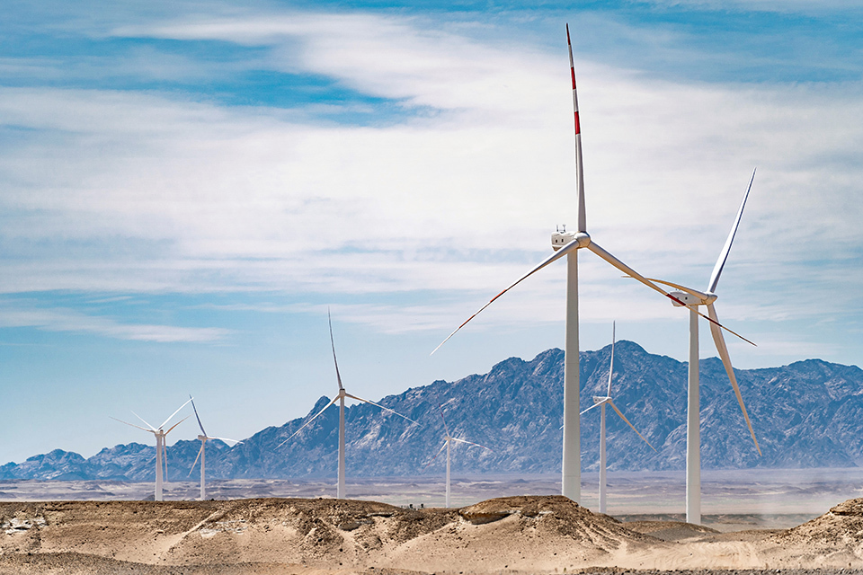 Wind turbines in a desert landscape.