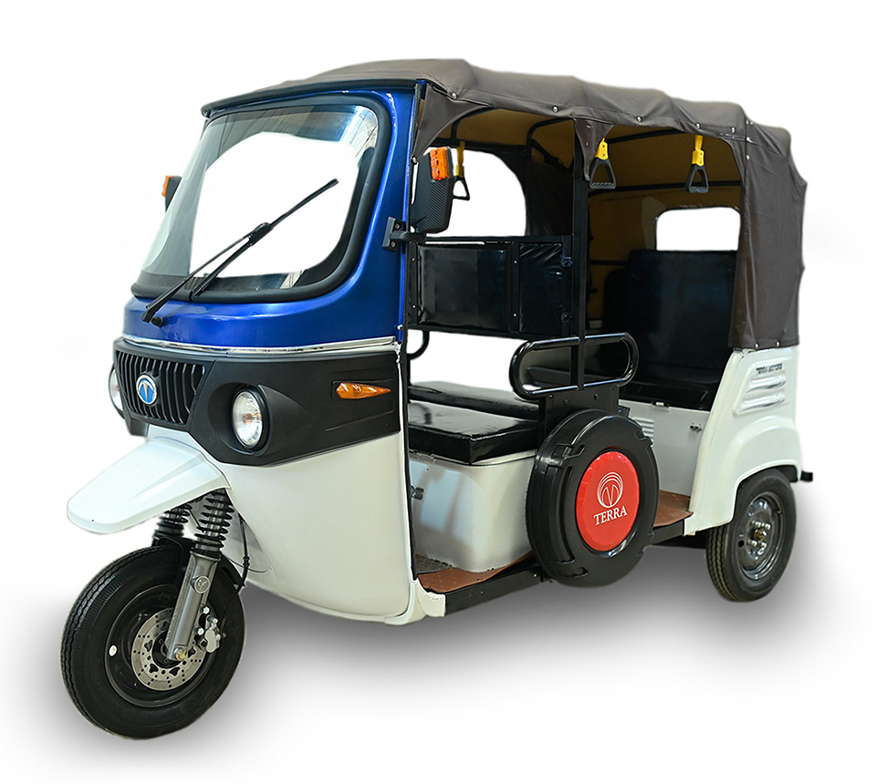 Terra Motors' electric three-wheel auto-rickshaw with covered canopy, marketed in India.