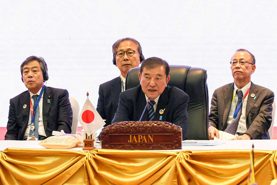 Prime Minister Ishiba speaks at the Asia Zero-Emission Community (AZEC) Leaders Meeting, seated behind a “Japan” nameplate and a small Japanese flag on display.