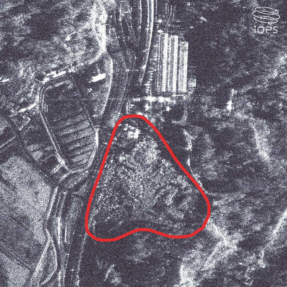 Satellite image capturing an aerial view of hills and roads, revealing slope collapses after the January 2024 Noto earthquake.