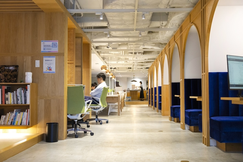 A coworking space featuring wooden walls, designed for collaboration and productivity.