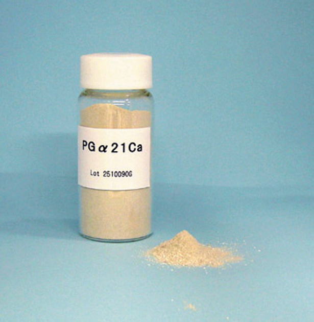 A close-up view of powder in a clear vial.